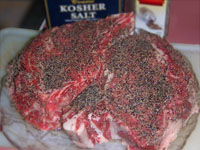 Picture of Seasoning a Rib Eye Steak.