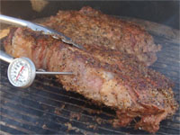 Clcik to enlarge this picture of Taking the Temperature of a Rib Eye Steak.
