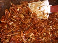 Chocolate Covered, Honey Pecans Coating the Pecans with Syrup Picture