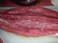 Orange, Jamaican Jerked Pork Tenderloin, cutting the meat, Picture