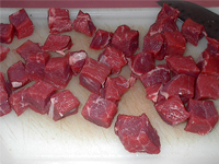 Cutting the Beef into Squares Picture