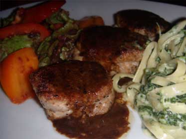 Pork Tenderloin Mignonettes, Plated with a Concentrated Pan Sauce Picture